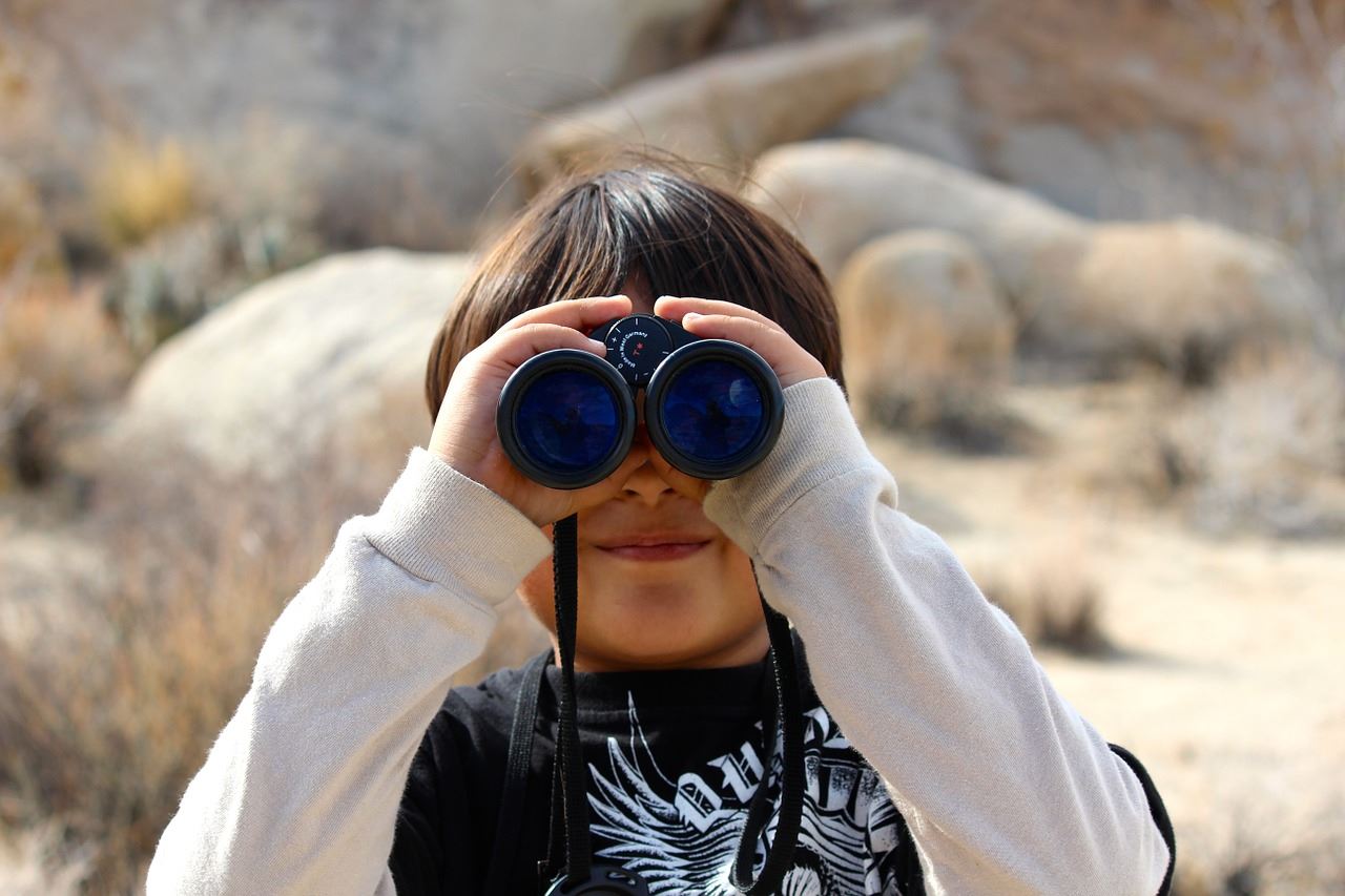 kid with binoculars